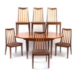 Mid century G Plan teak extending dining table and six chairs, the table 72cm high x 122cm in