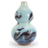 Chinese double gourd porcelain vase having a flambe glaze, 16cm high