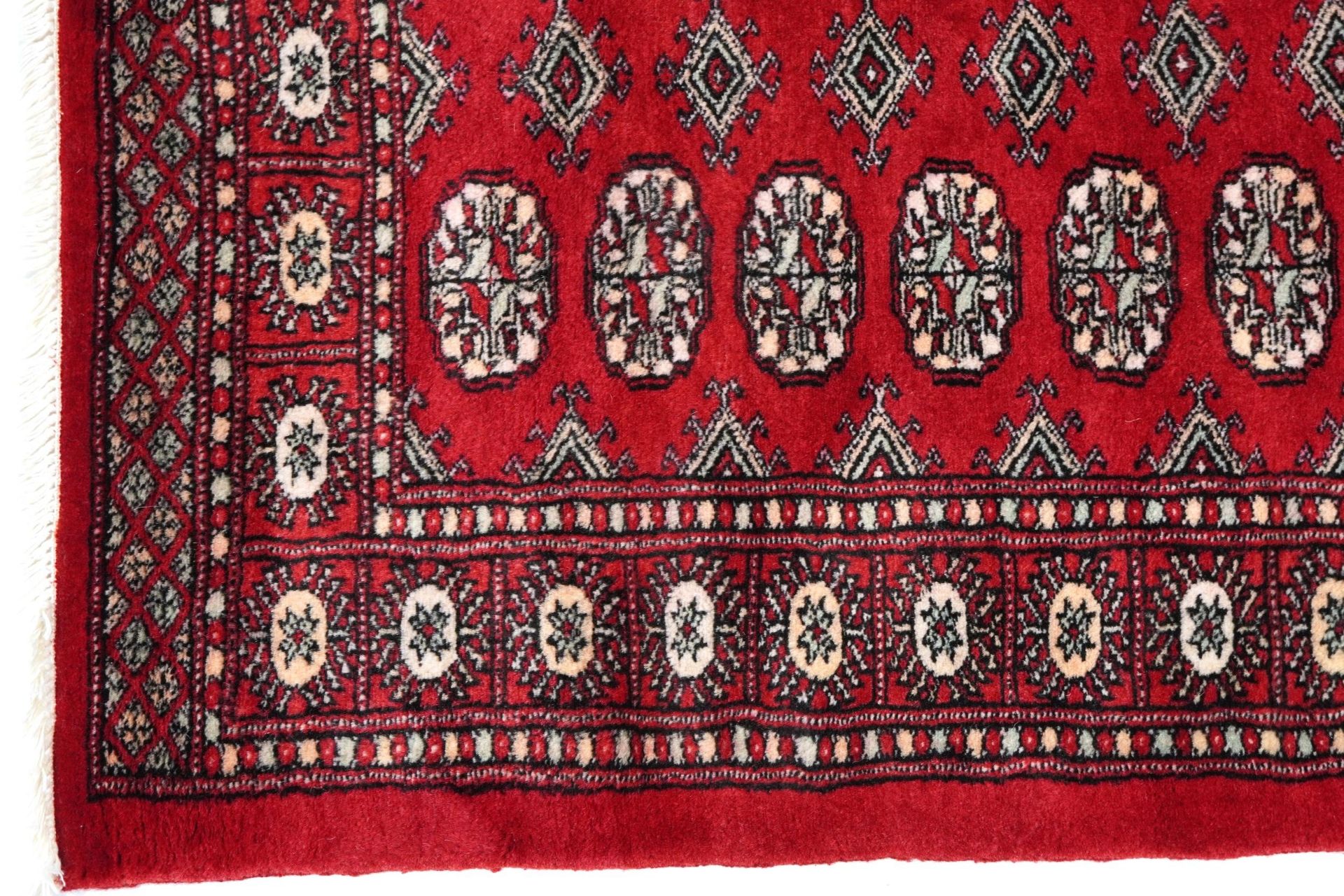 Rectangular Bokhara red ground rug having an all over geometric design, 154cm x 96cm - Image 4 of 6