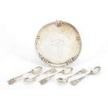 Golfing interest circular silver three footed salver and set of six teaspoons, the salver engraved