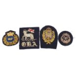 Four military interest cloth badges