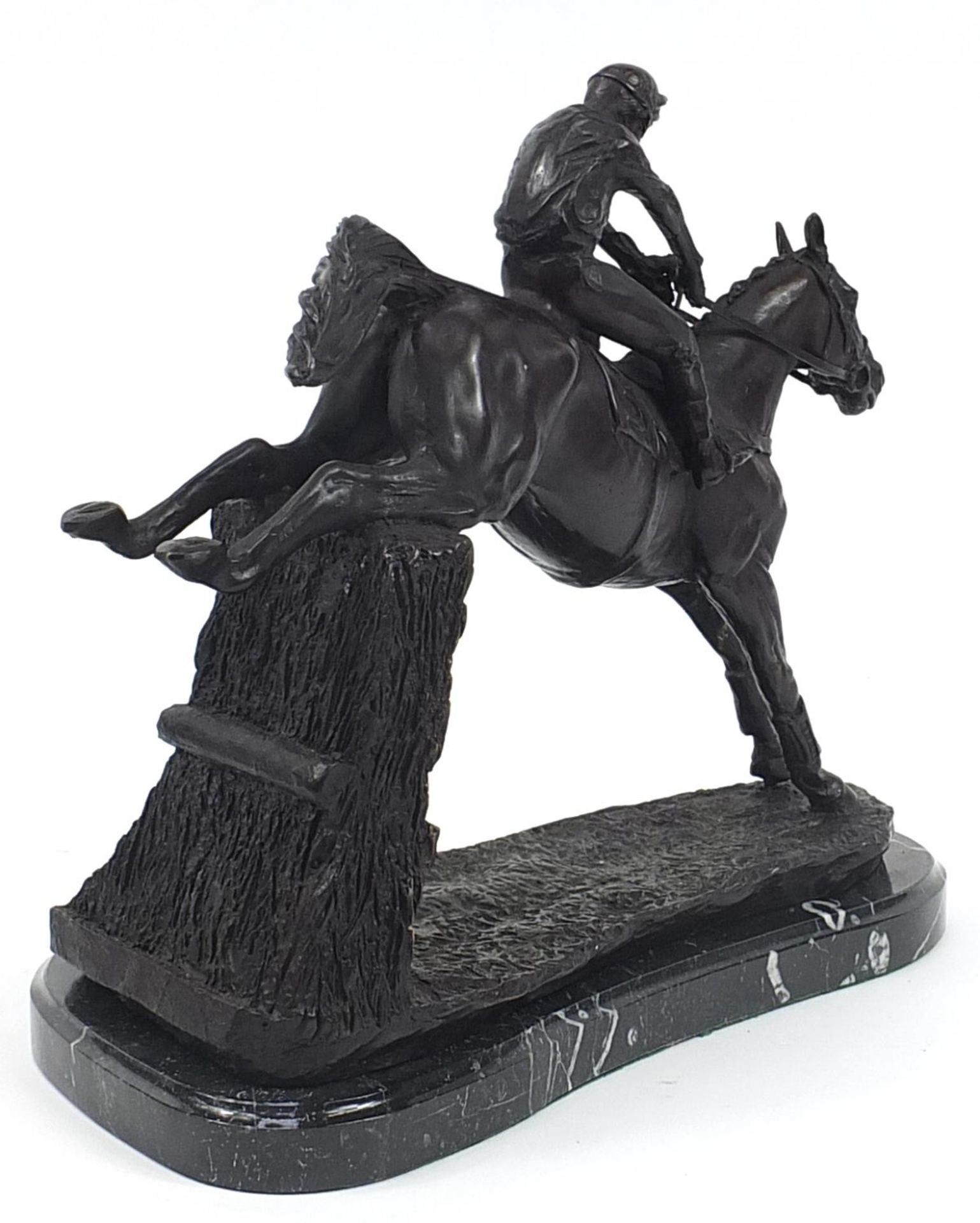 Large patinated bronze jockey on horseback raised on a black marble base, 35cm in length - Image 2 of 3