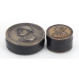 Two military interest snuff boxes including an Italian example, the largest 7.5cm in diameter