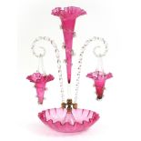 Victorian cranberry glass epergne centerpiece with two hanging baskets and trailed decoration,