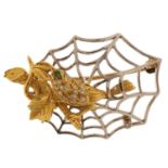 18ct yellow and white gold bird and spider web brooch set with diamonds and an emerald, 4.5cm