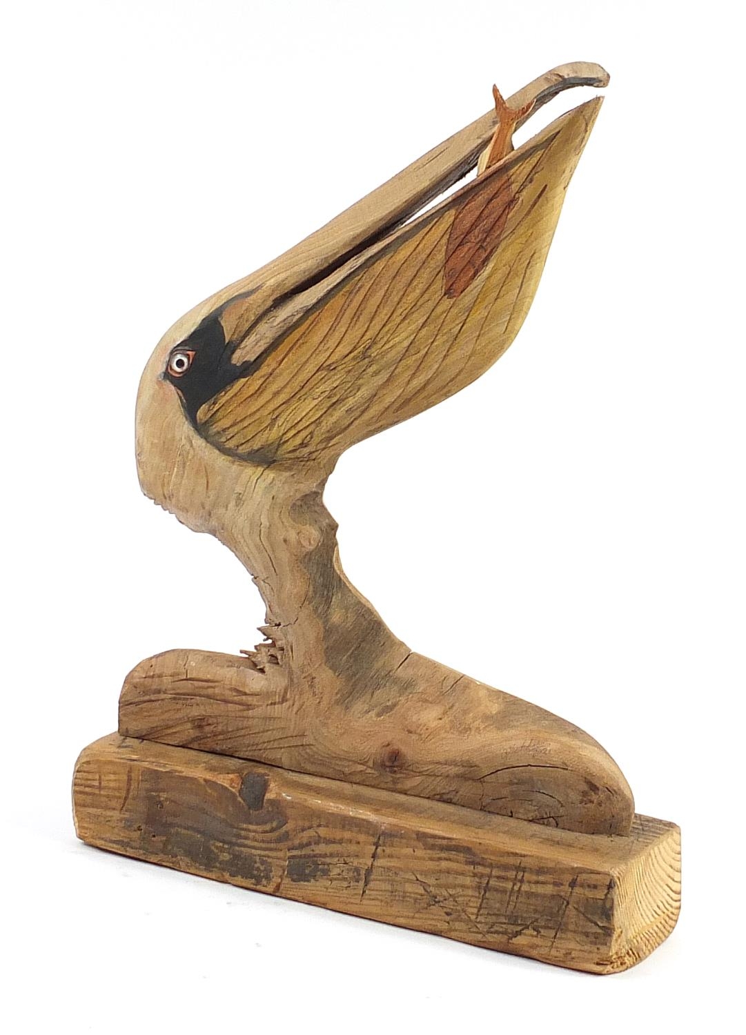 Clive Fredriksson 2021, driftwood carving of a stylised pelican with fish, 61cm high
