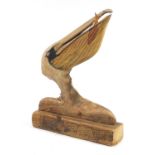 Clive Fredriksson 2021, driftwood carving of a stylised pelican with fish, 61cm high