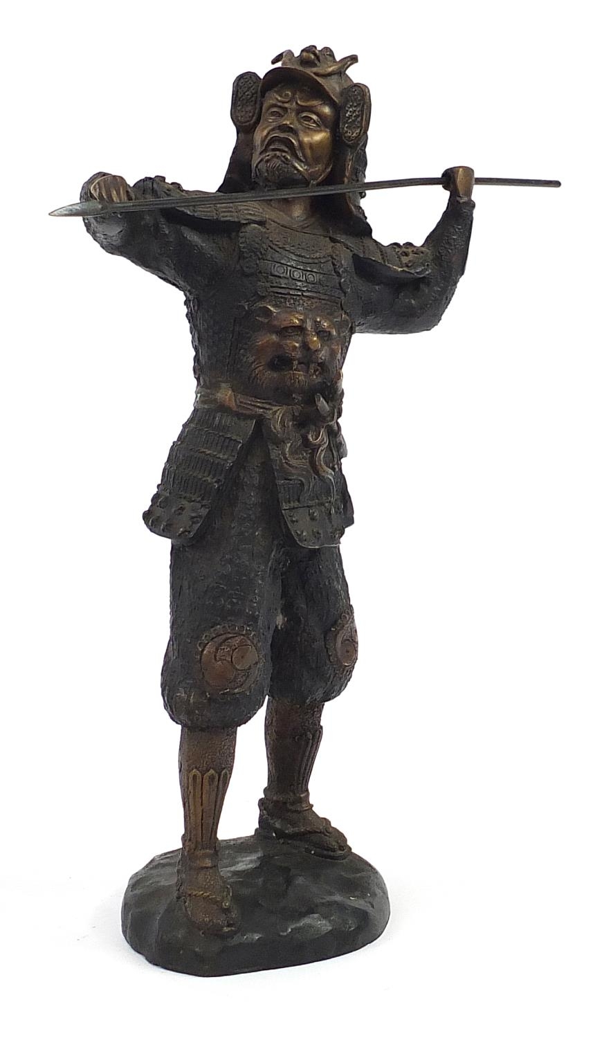 Large Japanese patinated bronze figure of a warrior throwing a spear, 46.5cm high