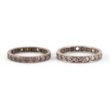Two unmarked white metal clear stone eternity rings, sizes N and P, 4.2g