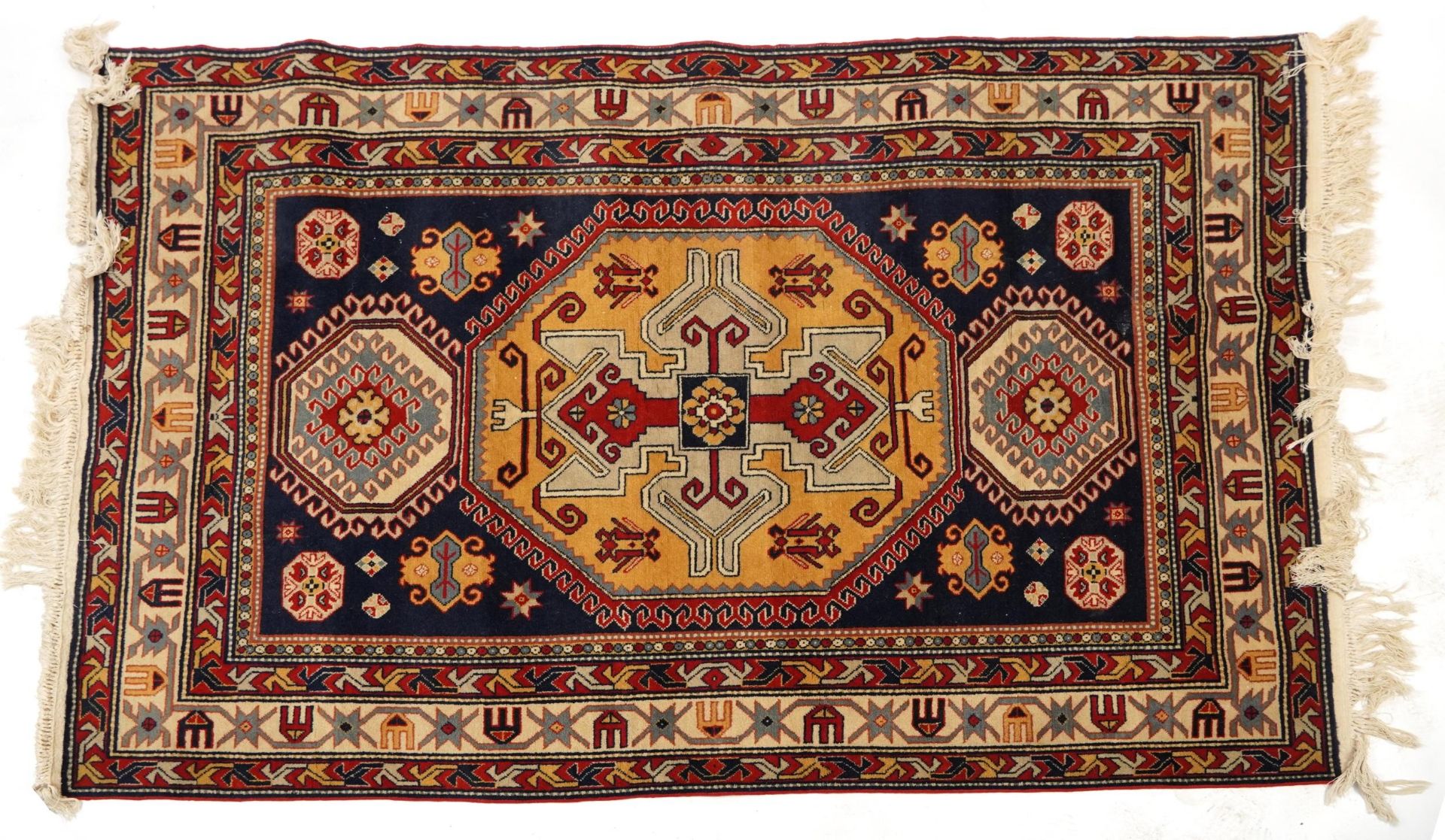 Rectangular Middle Eastern red and blue ground rug having an all over geometric design, 200cm x