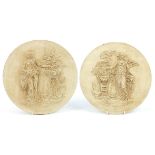 Pair of circular classical wall plaques decorated in relief with Grecian females, each 31cm in