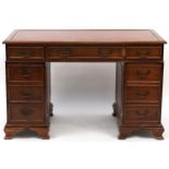 Mahogany nine drawer twin pedestal desk with red tooled leather top, 78cm H x 122cm W x 61cm D