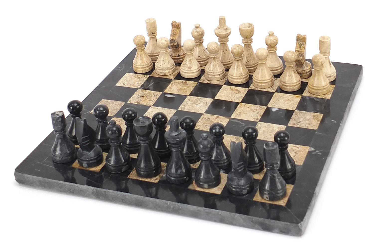 Carved stone chess set with inlaid marble board, the largest pieces each 6.5cm high, the board - Image 3 of 7