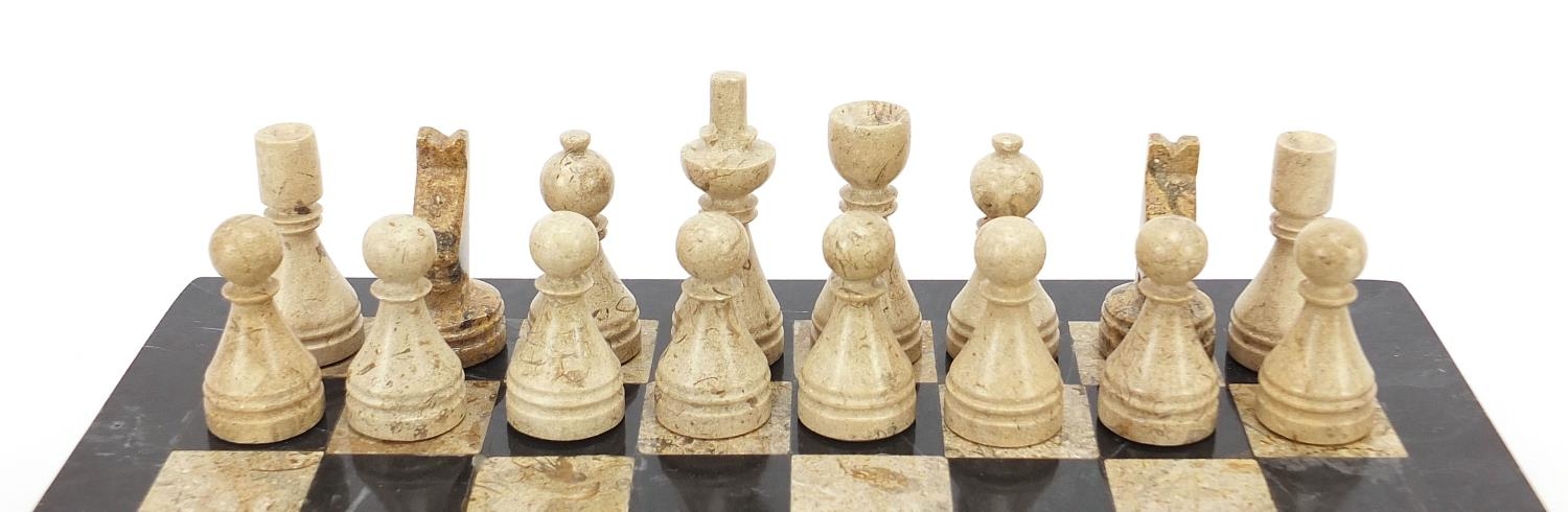 Carved stone chess set with inlaid marble board, the largest pieces each 6.5cm high, the board - Image 4 of 7