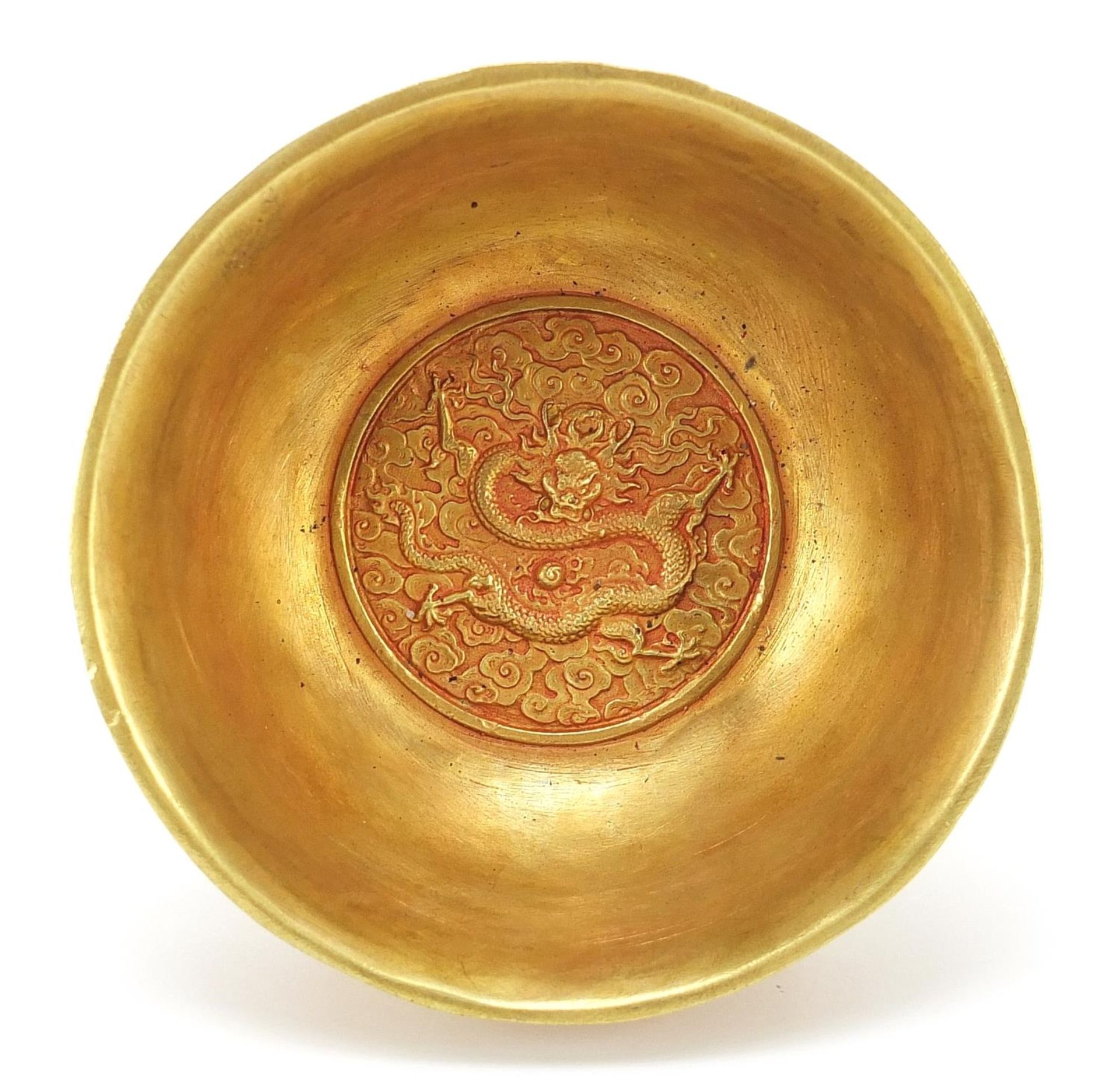 Chinese gilt bronze footed bowl cast with dragons amongst clouds chasing flaming pearls, four figure - Image 3 of 4