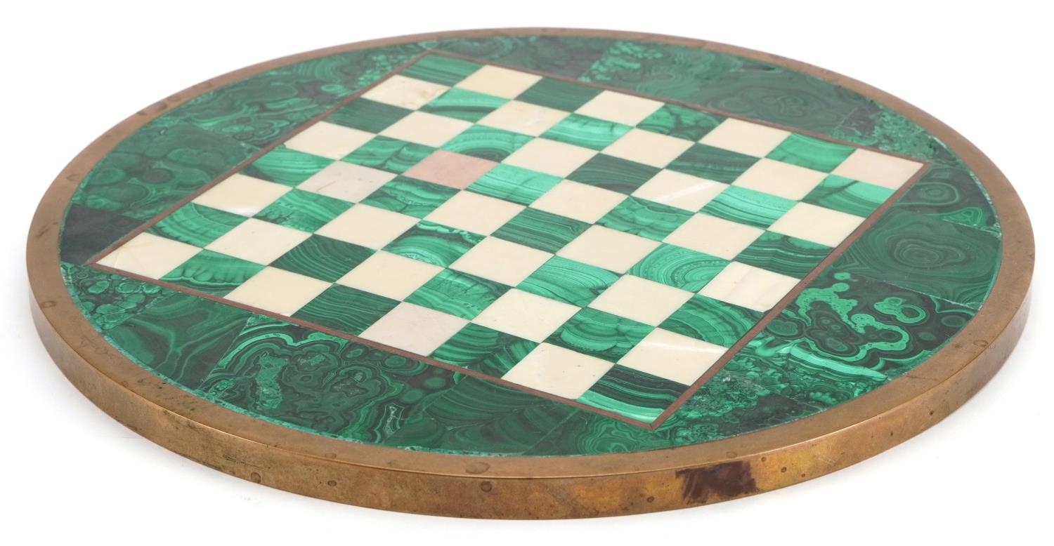 Circular malachite, alabaster and brass chess board, 32.5cm in diameter