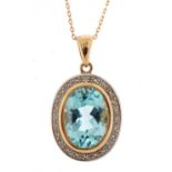 9ct gold diamond and blue topaz pendant on a 9ct gold necklace, 2.9cm high and 45cm in length, 4.5g
