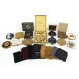 Twelve vintage ladies powder compacts and a tooled leather cigarette case, some enamelled