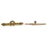 Two 9ct gold bar brooches including a Victorian horseshoe example set with diamonds and blue stones,