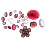 Collection of loose stones including diamonds, rubies and garnets, the largest 1.5cm in length