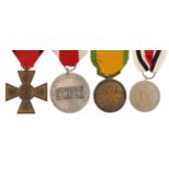 Four military interest medals including Poland Defence and German 1913 cross
