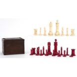 Half stained turned bone chess set, the largest piece 9cm high