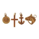 Four 9ct gold charms including horse's head and anchor, the largest 2.0cm high, 1.8g
