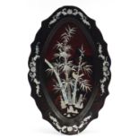 Oval Chinese lacquered and mother of pearl tray decorated with birds amongst bamboo, 48cm wide