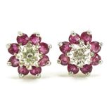 Pair of 9ct gold ruby and diamond flower head stud earrings, 8mm in diameter, 0.9g