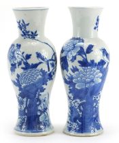 Pair of Chinese porcelain baluster vases hand painted with butterflies and birds amongst flowers,