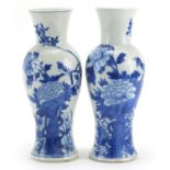 Pair of Chinese porcelain baluster vases hand painted with butterflies and birds amongst flowers,