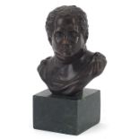 Patinated bronze bust of a Roman Emperor raised on a square green marble base, 14.5cm high