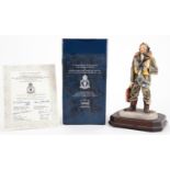 Ashmore for Worcester porcelain commemorative military figure raised on a wooden plinth base, RAF