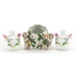 Continental floral encrusted china comprising a pair of vases with twin handles and Putti design