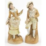 Pair of continental bisque figures of a young couple, the largest 32cm high
