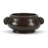 Chinese patinated bronze censer with ram's head handles, character marks to the base, 11cm wide