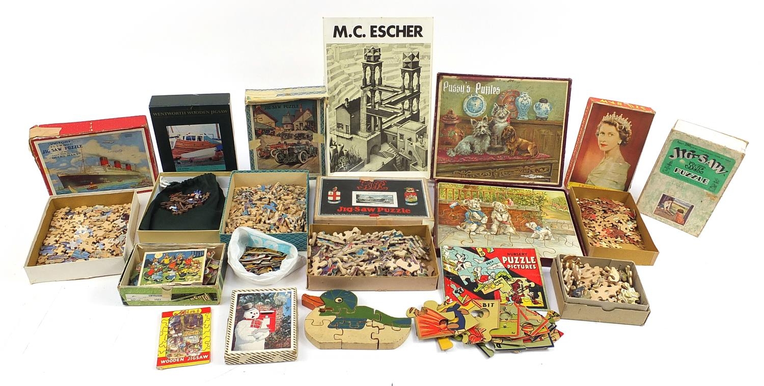 Collection of vintage and later wooden jigsaw puzzles, mostly with boxes