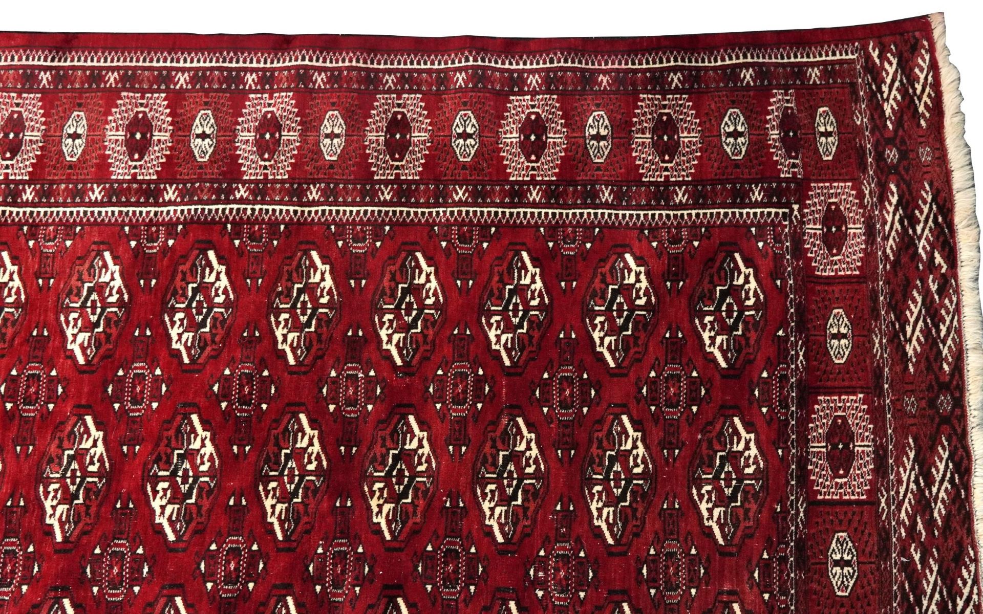 Rectangular Persian Turkmen red ground carpet having an all over geometric design, 345cm x 215cm - Image 4 of 8