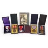 Five Japanese military interest medals with cases and photograph of soldier in question