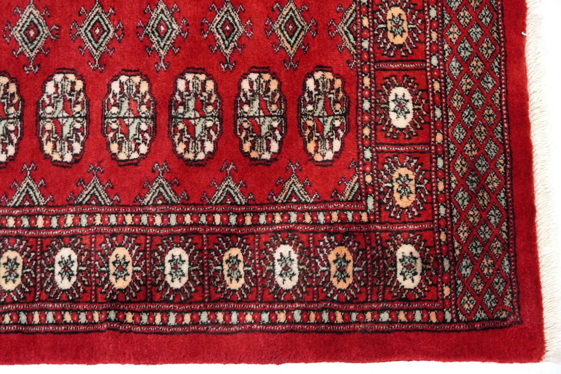 Rectangular Bokhara red ground rug having an all over geometric design, 154cm x 96cm - Image 5 of 6