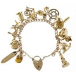 9ct gold charm bracelet with a collection of mostly 9ct gold charms, 49.0g