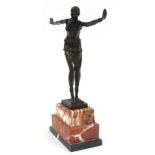Large patinated bronze figurine of an Art Deco style dancer raised on a stepped marble base, 49cm
