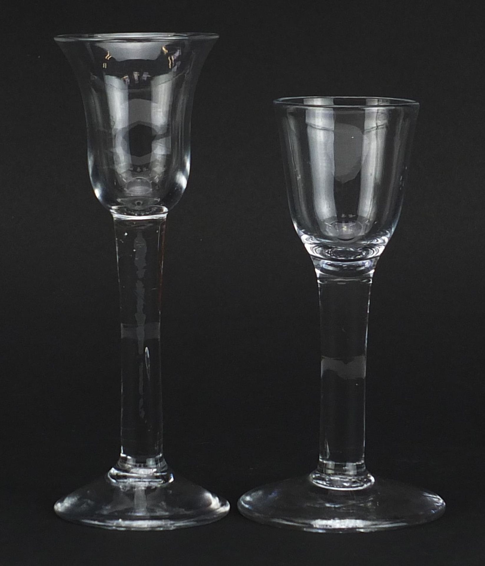 Two 18th century wine glasses including one with bell shaped bowl, the largest 15cm high