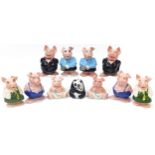 Two sets of five Wade Natwest pig money banks and panda money bank, the largest 19cm high