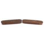Pair of Islamic wooden pen boxes carved with leaves and flowers, each 24.5cm in length