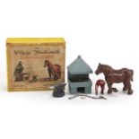 Vintage hand painted lead village blacksmith by Miniature Models number 169 with box, the horse