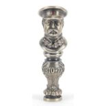 Silver desk seal in the form of a Russian officer in uniform set with clear stones and a ruby,