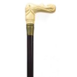 Hardwood walking stick with carved bone nude female handle, 87cm in length