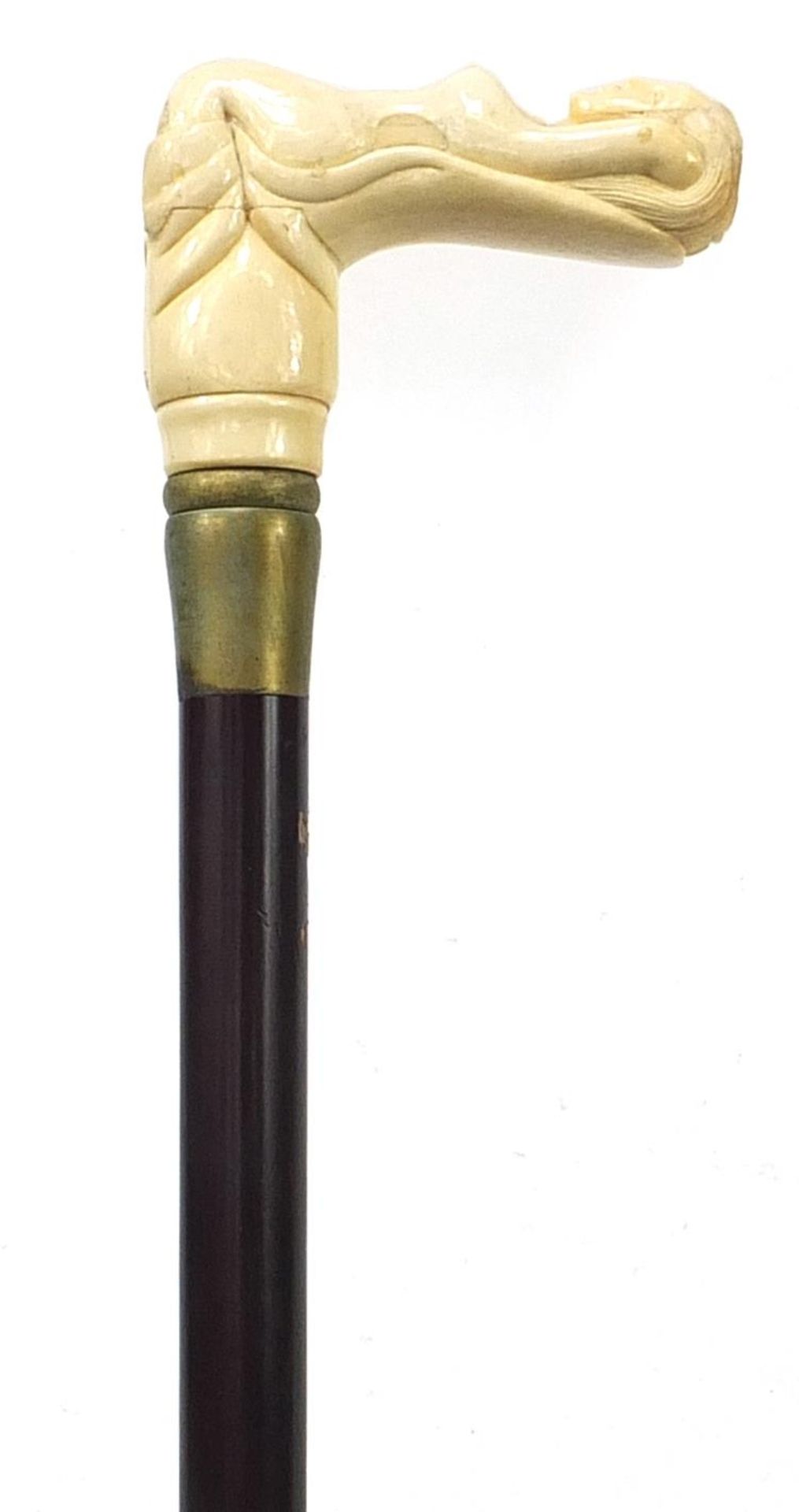 Hardwood walking stick with carved bone nude female handle, 87cm in length