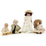 Four miniature bisque headed dolls, the largest 16cms high